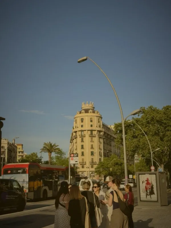 Barcelona street scene with historic building and red bus